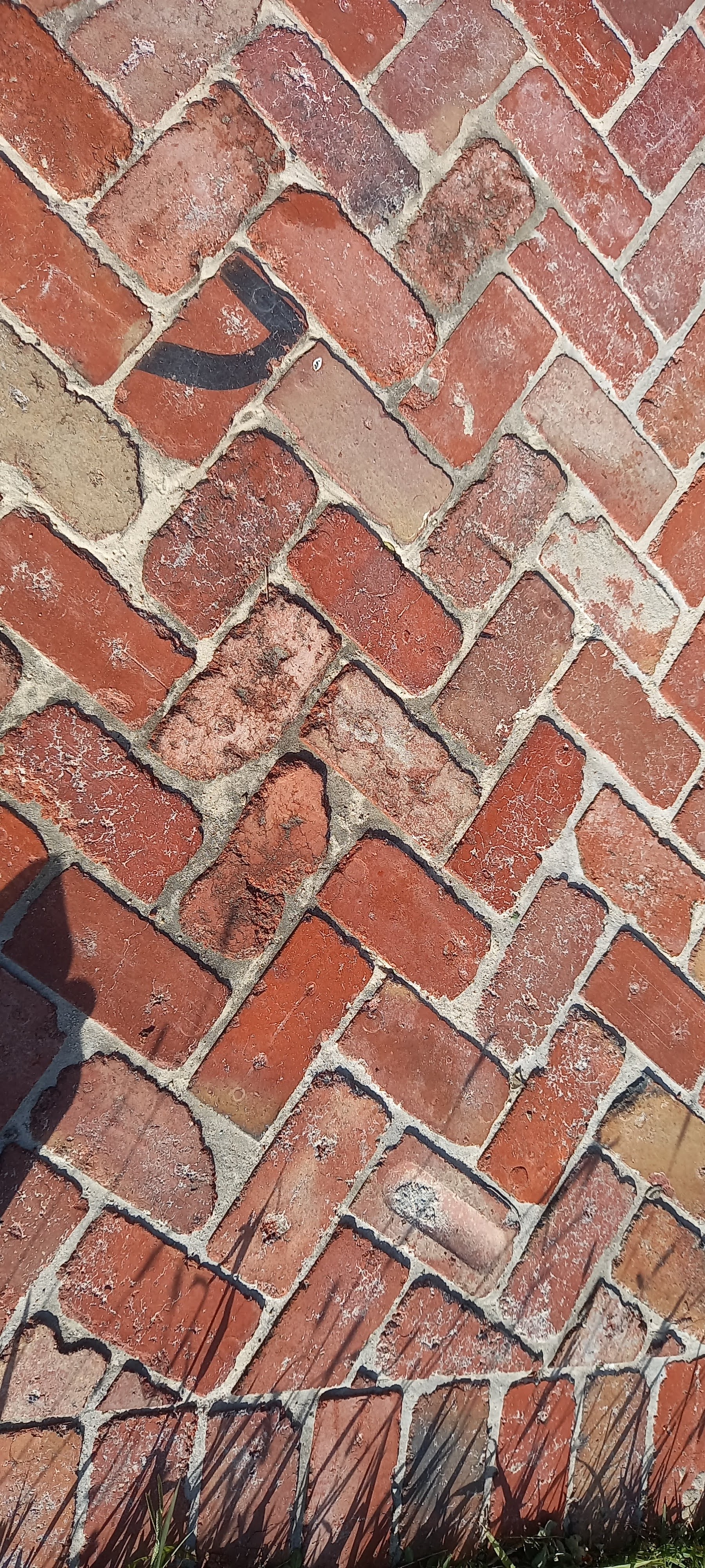 Brick herringbone pattern on a residential driveway