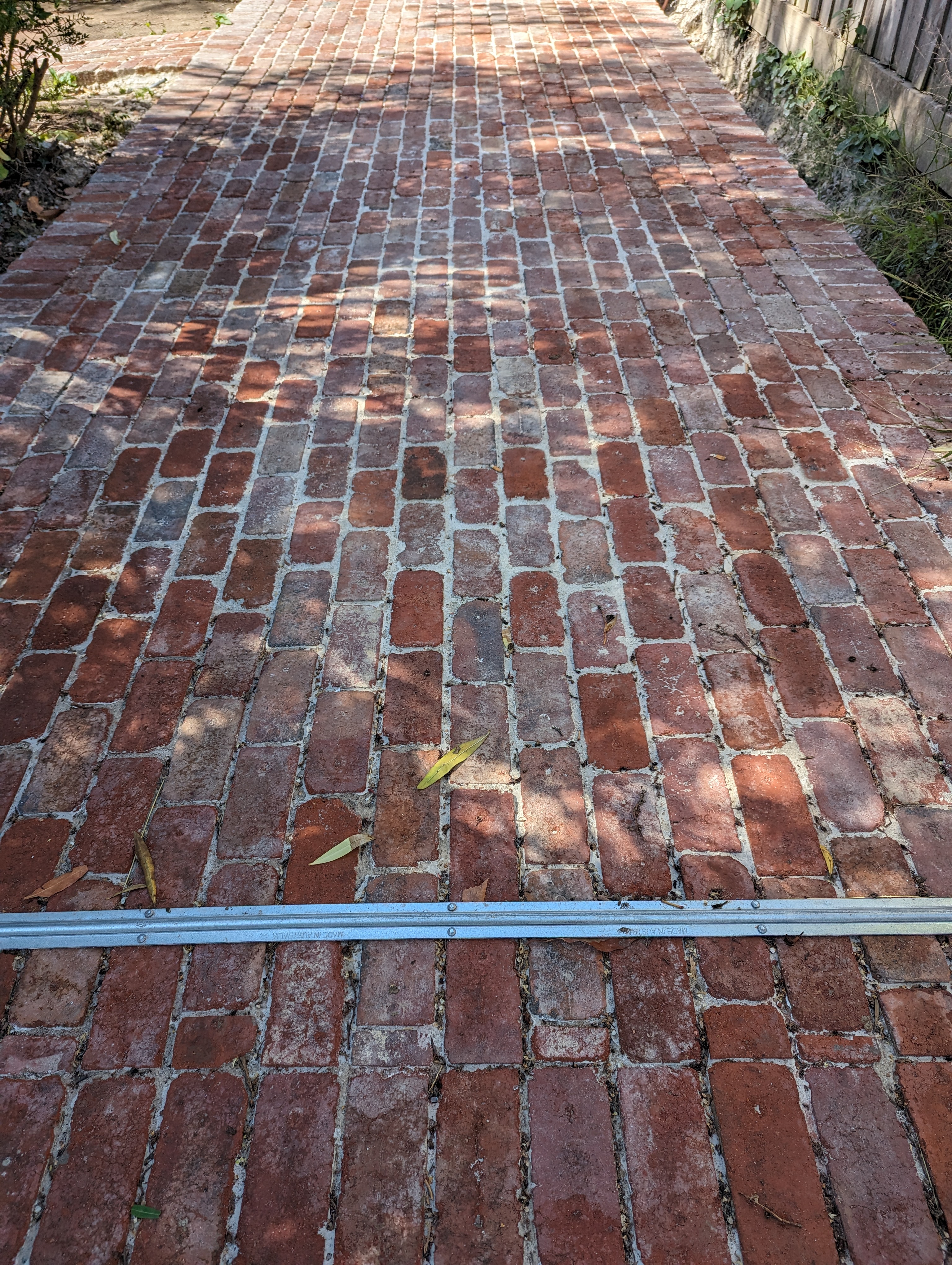 Stretcher bond concrete pavers on a wide residential driveway